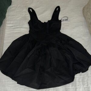 Black dress by 12th tribe. X small. Non smoker. Never worn